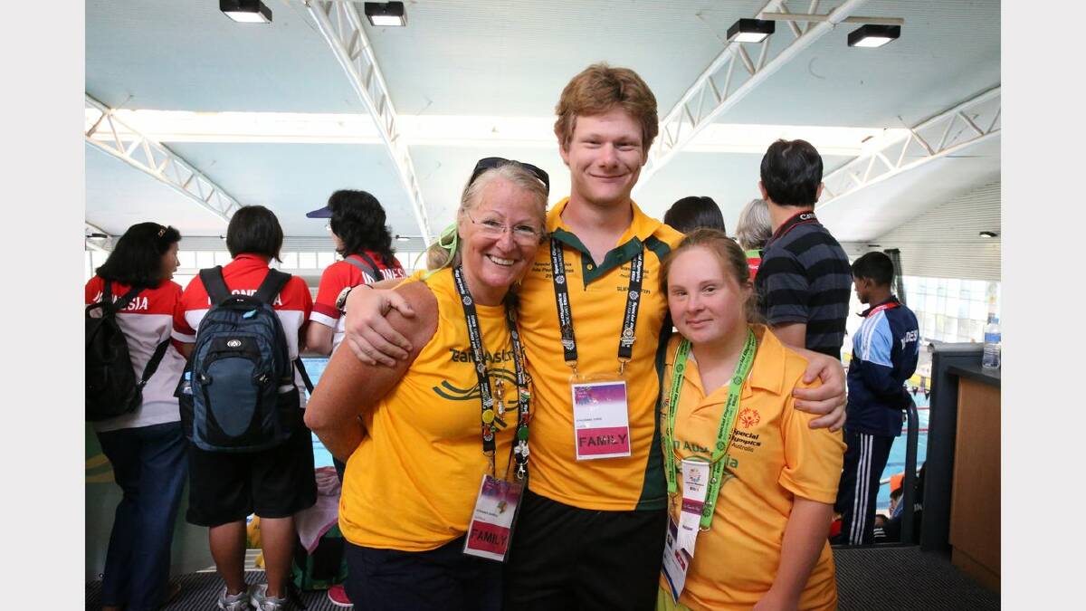Scenes from the Special Olympics swimming at The Forum pool.  Ashley Kate Schlienner got a participation because her results were too good. She is with her brother Chris and mum Barbara.  Picture: Dean Osland. 