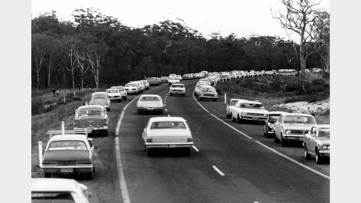 Sightseers cars at overpass of Cox's lane, Fullerton Cove for Sygna