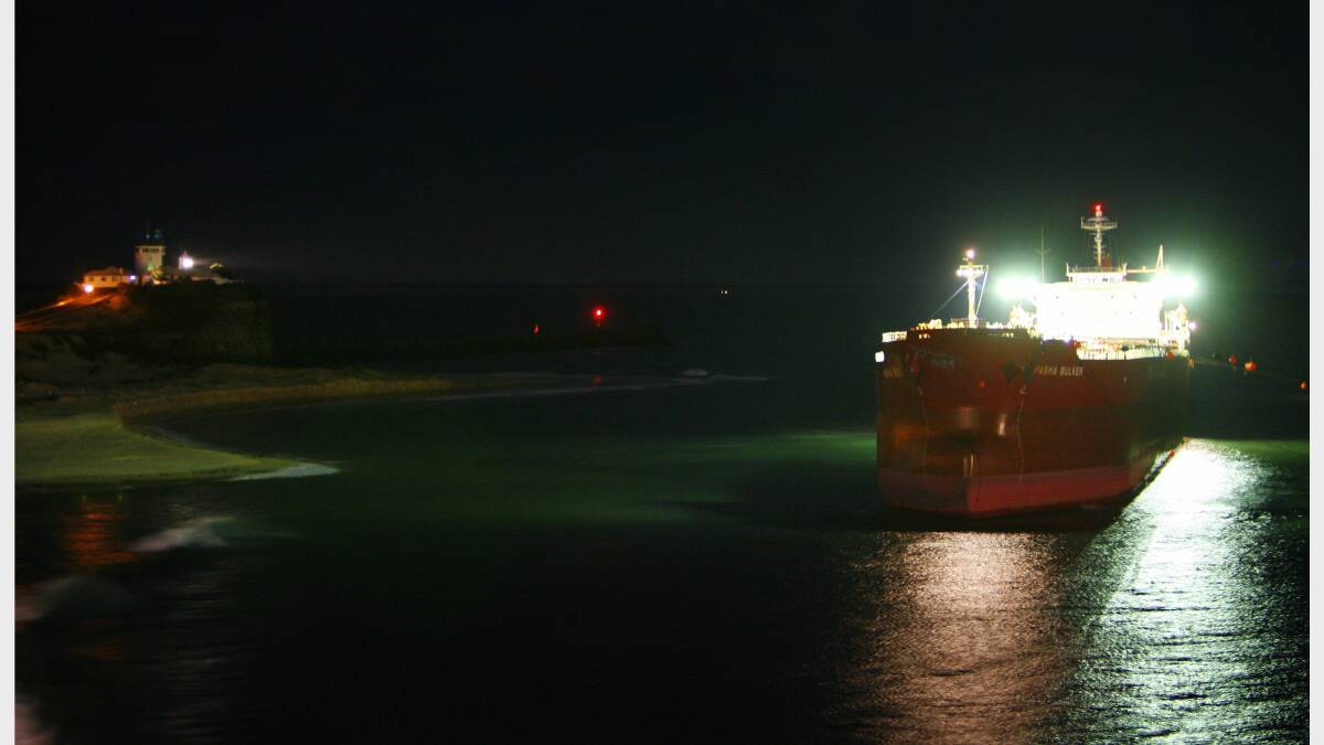 The Pasha Bulker moves slowly out to sea after a salvage attempt at Nobbys Beach. Credit: KITTY HILL