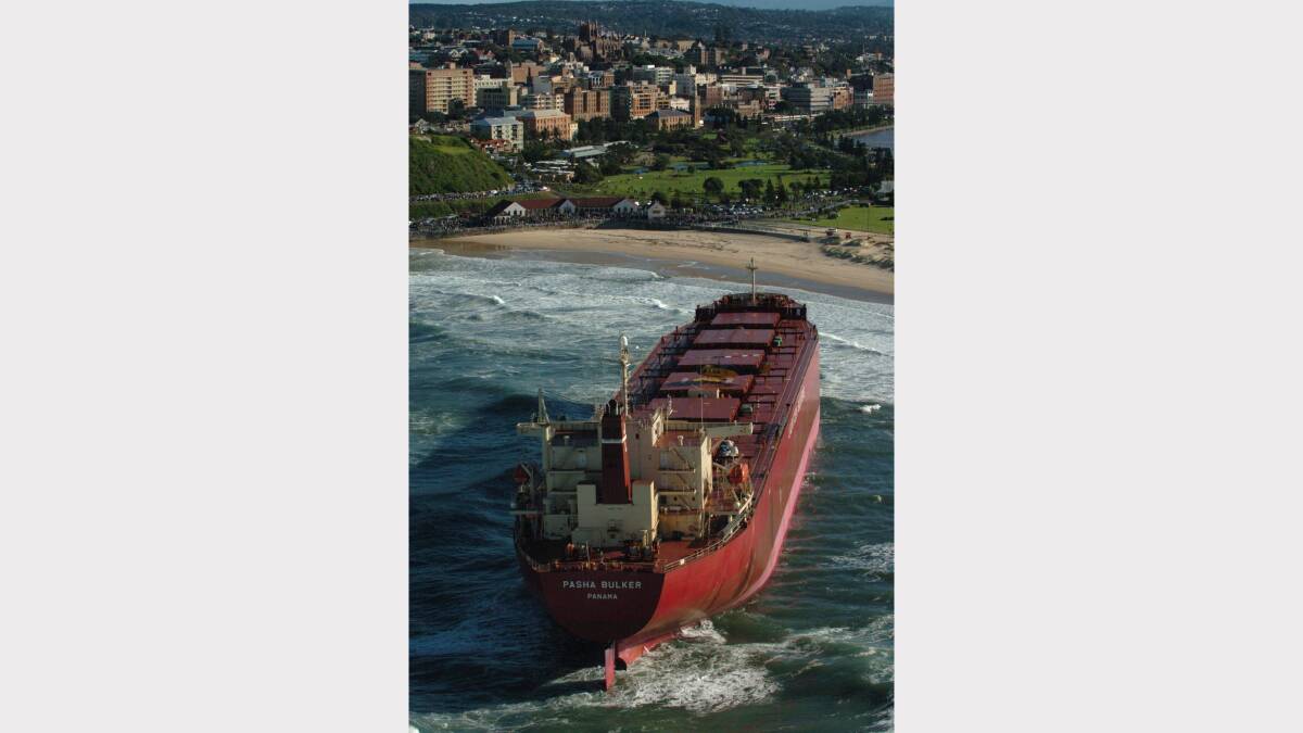 The Pasha Bulker sits off Nobby's Beach, Newcastle, Monday, June 11, 2007. The Pasha Bulker ran aground on Friday after a massive storm lashed the coast causing major flooding on the Central Coast, Hunter Valley and Newcastle regions. Credit: AAP Image/Dean Lewins