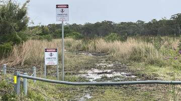 Asbestos signs erected on the boundary of the bushland buffer around the old Munmorah power station site. Picture supplied 